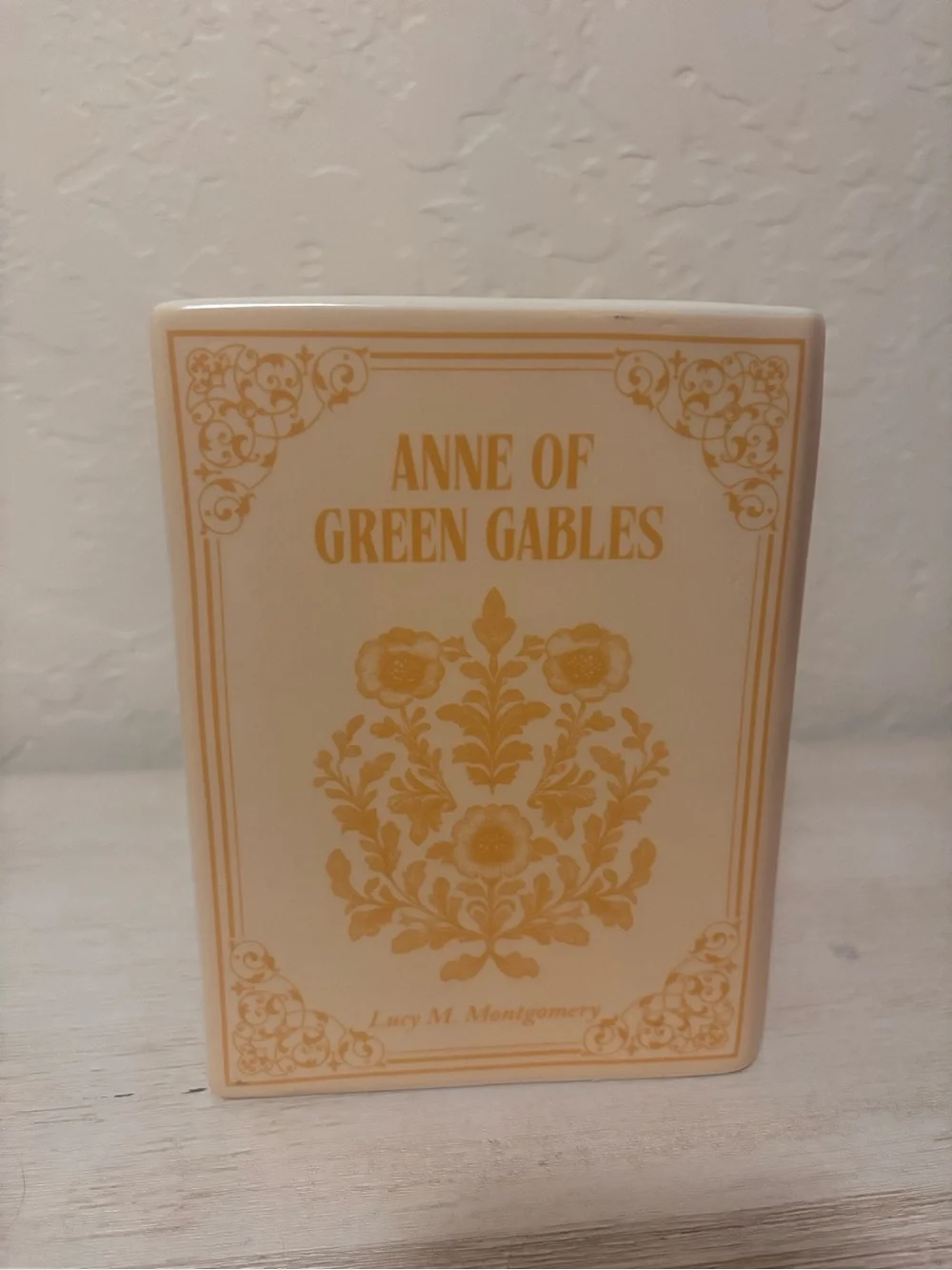 Anne of Green Gables book vase. ceramic book vase with vertical ribbed texture.